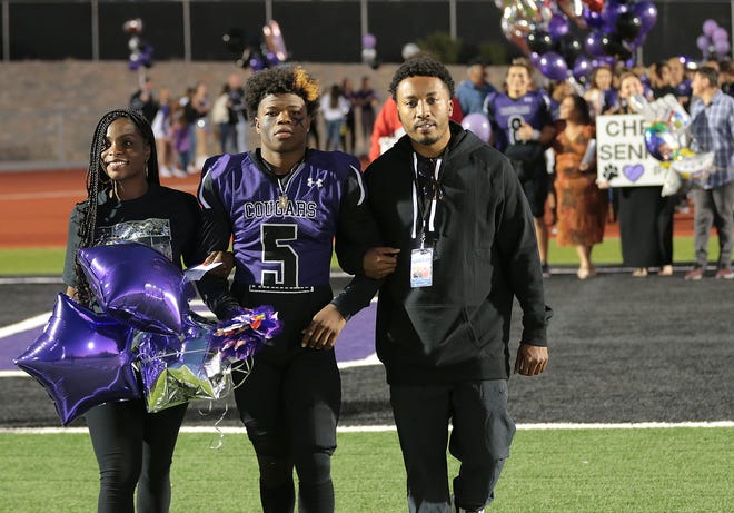 Franklin High School football player James McClain-Green, center, was honored during senior night earlier this season when the Cougars played Pebble Hills.