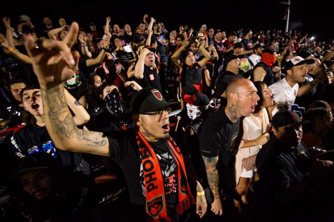 Fans cheer on the Rising on June 29, 2018, during Phoenix Rising FC's 1-0 win against the Orange County Soccer Club at the Phoenix Rising FC Soccer Complex in Tempe, Arizona.