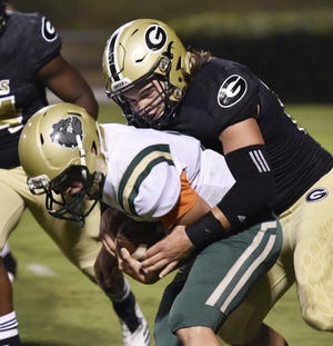 Sophomore linebacker Garrett Dill, right, and the Greer defense have limited opponents to 11.2 points per game during the team's nine-game winning streak.