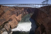 Water is released from Glen Canyon Dam through a bypass tube on Nov. 5, 2018, during a high-flow experiment.