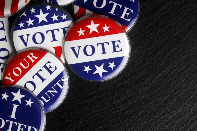 Red, white, and blue vote buttons background