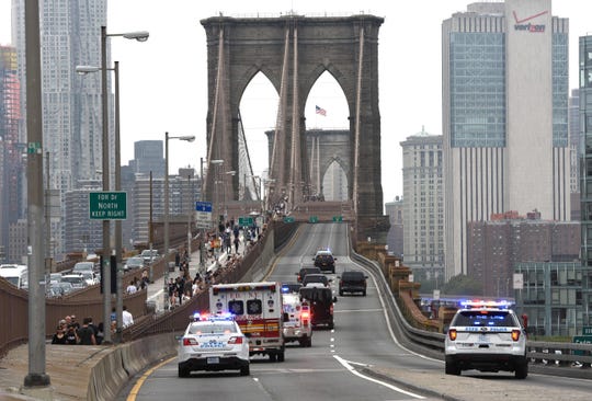 In this file photo taken on October 10, 2018 Mexican drugs kingpin Joaquin 'El Chapo' Guzman is escorted by police motorcade across the Brooklyn Bridge back to jail in lower Manhattan after his court appearance in Federal District Court in Brooklyn.