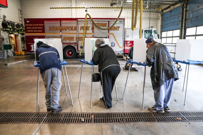 Voters fill in their ballots inside of the Indianapolis Fire Department's Station 1 on Tuesday, Nov. 6, 2018. 