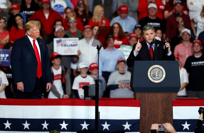 Fox News host Sean Hannity (right) speaks as President Donald Trump listens during a campaign rally Nov. 5, 2018, in Cape Girardeau, Missouri.