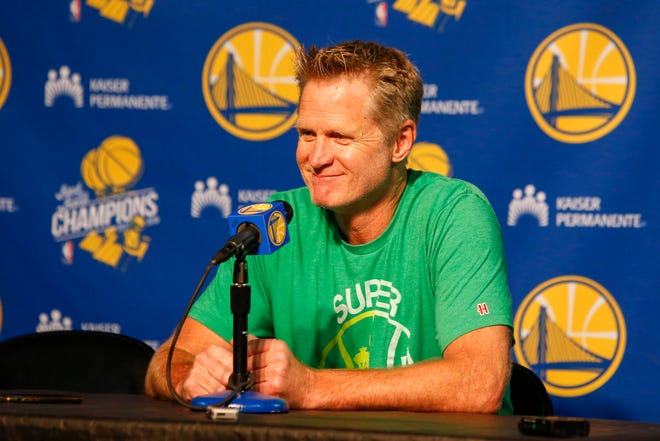 Golden State Warriors head coach Steve Kerr answers questions at a press conference before a preseason game against the Sacramento Kings at KeyArena.