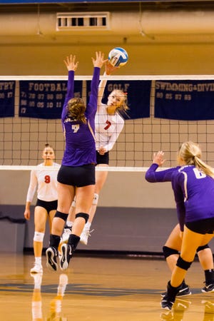 Marshall's Olivia Webber goes for the kills during this Division 2 regional semifinal against Fowlerville.