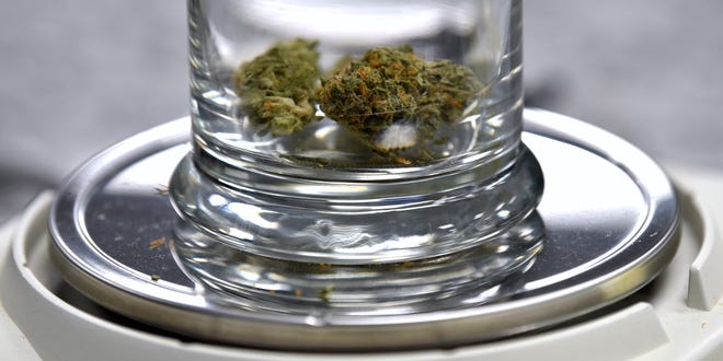 This is 1/8th of an ounce of Blue Zkittles on the scale at Far West Holistic Center. Employees called, "Bud Tenders," assist medical marijuana patients as they purchase products, Wednesday afternoon, November 7, 2018.