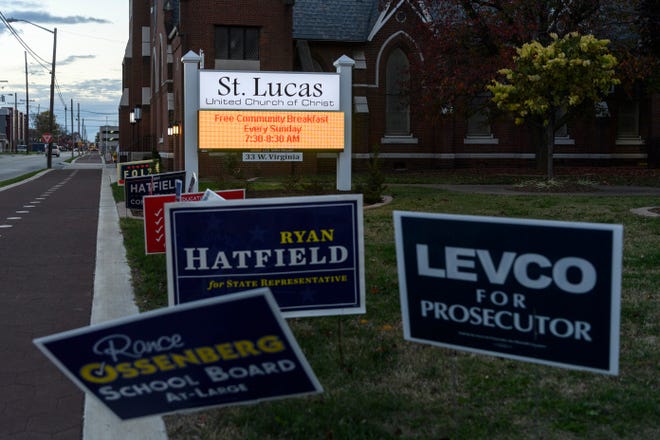 Candidate signs are displayed in front of St. Lucas United Church of Christ in Evansville, Ind., Tuesday evening Nov. 6, 2018. The church was one of 22 voting centers set up around Vanderburgh County. 