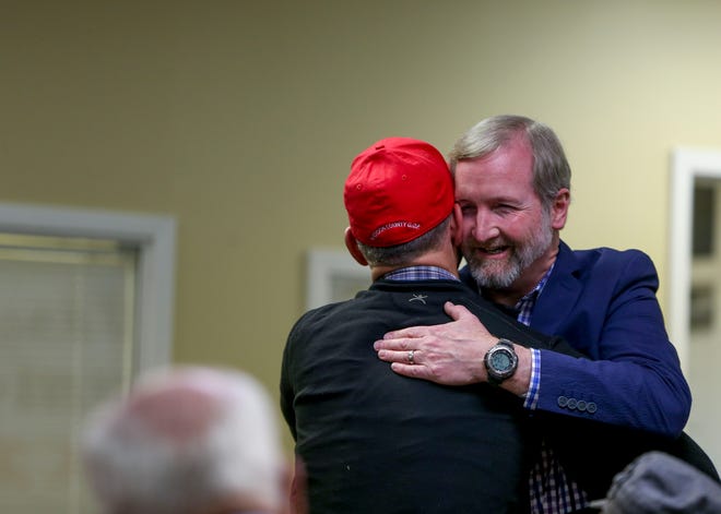 Chris Todd, state Representative for District 73, embraces Glen Gaugh after arriving at an election night watch party at Madison County Republican Headquarters in Jackson, Tenn., on Tuesday, Nov. 6, 2018.