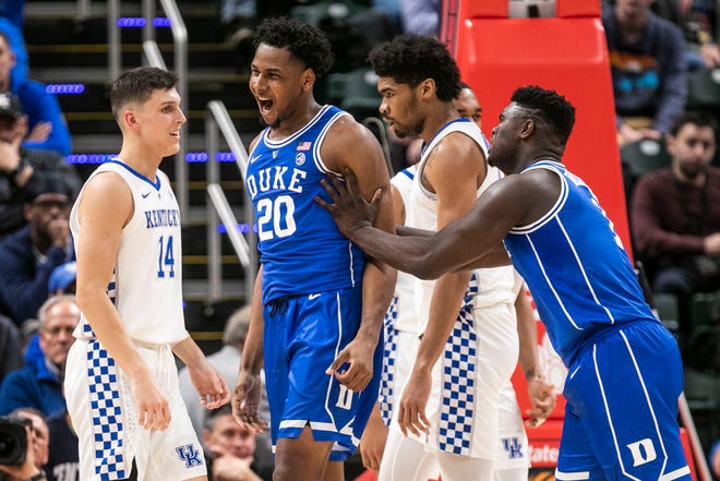 Duke's Marques Bolden celebrates after drawing the foul and two points against Kentucky's Tyler Herro in the first half in the Champions Classic Tuesday night. Nov. 6, 2018