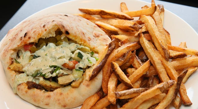 Falafel Guys' chicken shawarma sandwich with fries will be on the menu at the new location in Crossroads Collective food hall, 2238 N. Farwell Ave., due to open in November.