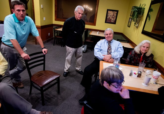 Dimitri Polizos, House District 74 incumbent, watches election returns with supporters at Mr. Gus' in Montgomery, Ala., on Tuesday November 6, 2018.