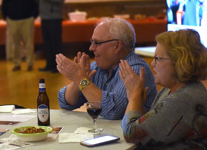 Licking County Commissioner Rick Black and wife Beth Black clap as Rick takes the lead over Adam Rhodes in the commissioners race on Tuesday, Nov. 6, 2018.