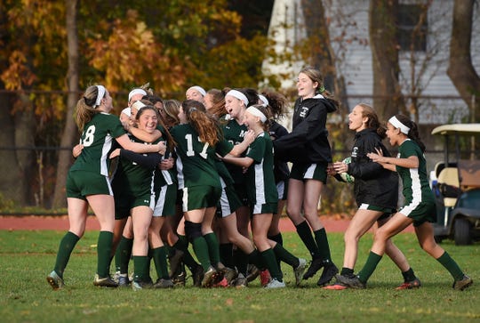 Midland Park players celebrate their victory 6 to 1 over Saddle Brook during the North 1, Group 1 girls soccer semifinal at Midland Park High School on 11/07/18. 