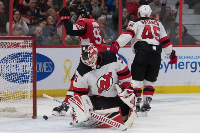New Jersey Devils goalie Cory Schneider (35) reacts to a goal scored in the second period against the Ottawa Senators at Canadian Tire Centre.
