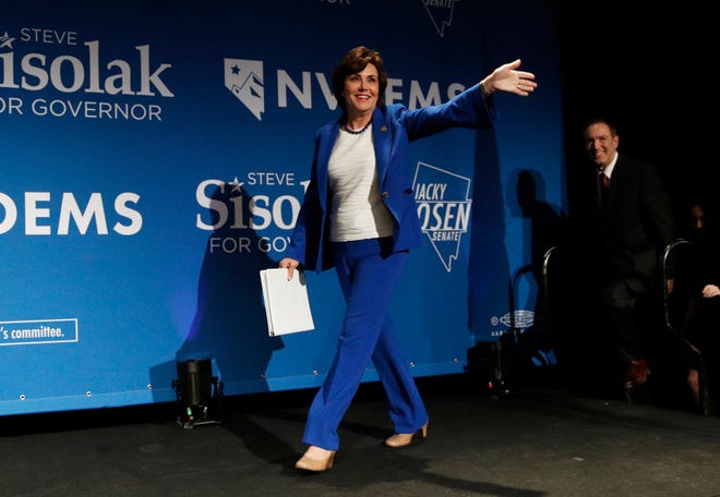 Rep. Jacky Rosen, D-Nev., takes the stage at a Democratic election night party Wednesday, Nov. 7, 2018, in Las Vegas, after defeating Sen. Dean Heller, R-Nev.,. (AP Photo/John Locher)