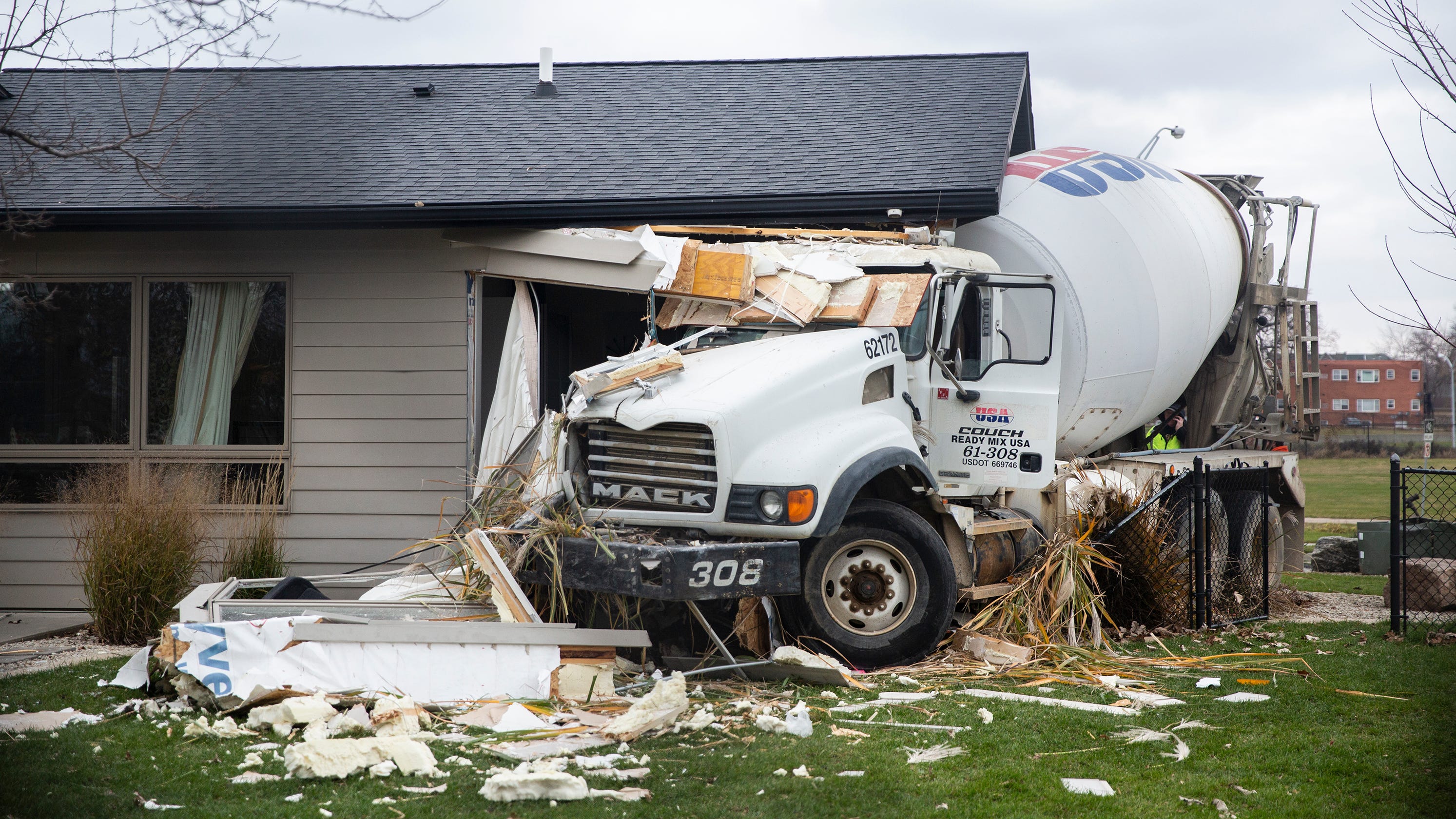 Photos: Cement truck crashes into a Des Moines home