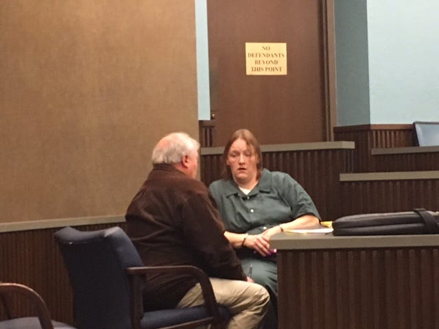 Jennifer Sweat, 44, talks with her attorney Bernie Davis Thursday following a preliminary hearing in Mansfield Municipal Court Judge Jerry Ault's courtroom. Sweat is charged with involuntary manslaughter in connection with the death of her 77-year-old mother.
