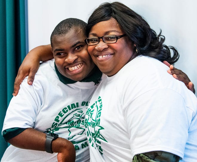 Mary Bradley hugs her son Joseph Bradley on Thursday November 8, 2018 at Jeff Davis High School in Montgomery, Ala. Joseph has been chosen to be on the Special Olympics equestrian team competing at the Special Olympics World Games in Abu Dhabi next year.