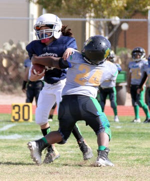 The Southwestern New Mexico Football League held its Super Bowl Sunday on Nov. 4 at the Deming High Memorial Stadium. The Deming Cowboys completed an undefeated season with a 33-0 championship win over the Deming Outlaws. Here are some action photos from the Super Bowl contest.