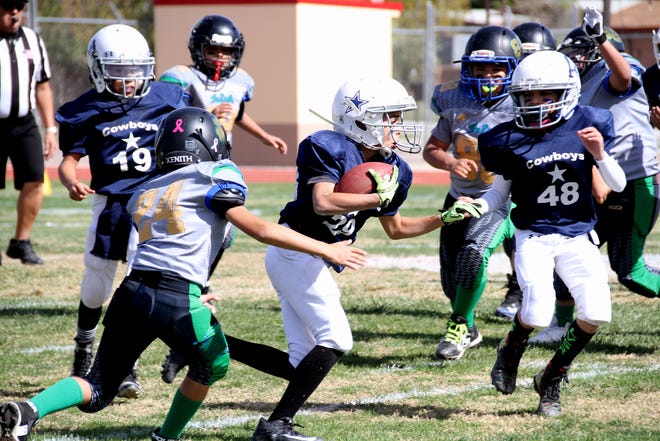 The Southwestern New Mexico Football League held its Super Bowl Sunday on Nov. 4 at the Deming High Memorial Stadium. The Deming Cowboys completed an undefeated season with a 33-0 championship win over the Deming Outlaws. Here are some action photos from the Super Bowl contest.