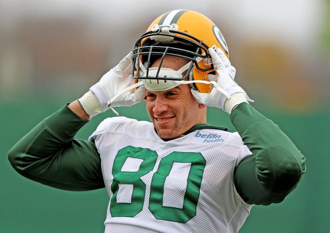 Green Bay Packers tight end Jimmy Graham (80) makes a face as he dons his helmet during practice Thursday, November 8, 2018 at the Don Hutson Center in Ashwaubenon, Wis.