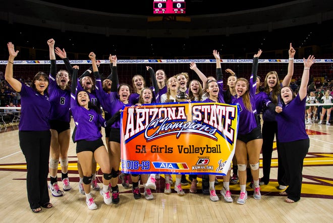 Millennium's players celebrate their three set 5A State Championship win over Sunnyslope in the girls 5A volleyball state championship at Wells Fargo Arena in Tempe, Wednesday, Nov. 7, 2018. 