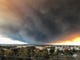 The massive plume from the Camp Fire, burning in the Feather River Canyon and near Paradise, wafts over the Sacramento Valley as seen from Chico on Thursday morning. (David Little -- Enterprise-Record)