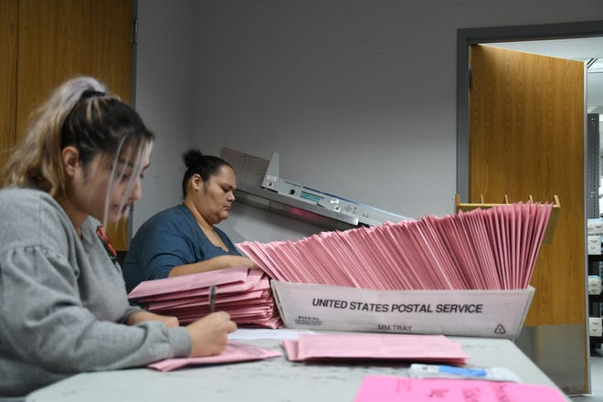The Tulare County Elections Office hired temporary workers Jessica Herrera and Rebecca Gutierrez to help count some 30,000 ballots.