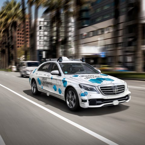 German automaker Daimler and supplier Bosch are...