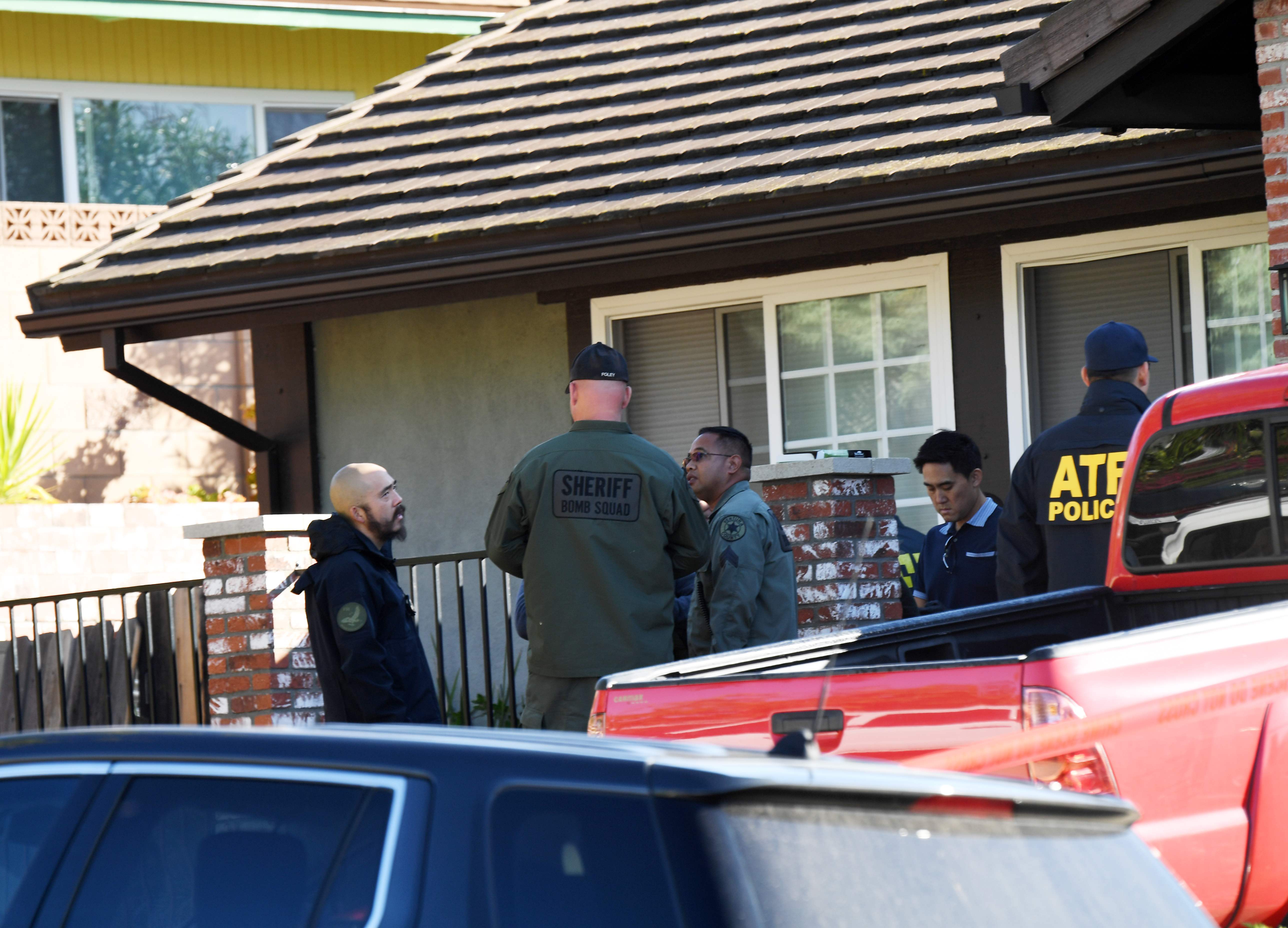 The home of Ian David Long is searched on Thursday in Thousand Oaks, California.