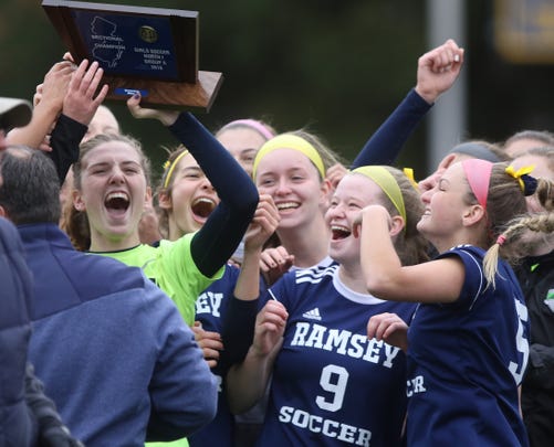 Ramsey celebrates their North 1, Group 2 girls soccer sectional title.