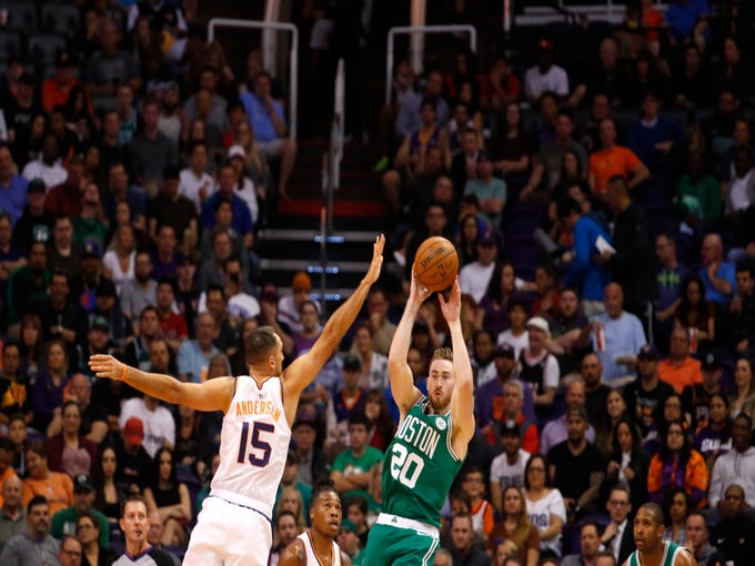 Suns' Ryan Anderson (15) defends Celtics' Gordon Hayward (20) as he makes a pass during the first half at Talking Stick Resort Arena in Phoenix, Ariz. on November 8, 2018.