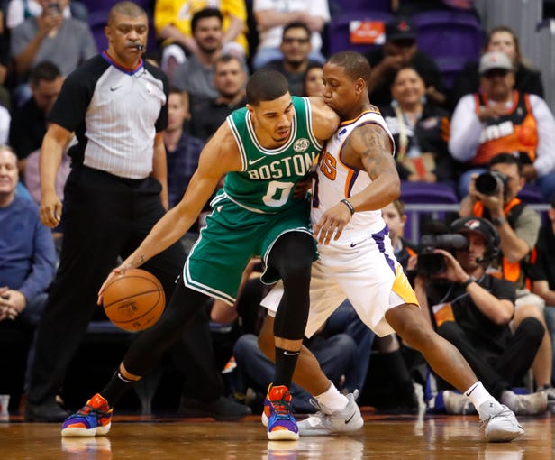 Celtics' Jayson Tatum (0) backs down Suns' Isaiah Canaan (0) during the first half at Talking Stick Resort Arena in Phoenix, Ariz. on November 8, 2018.
