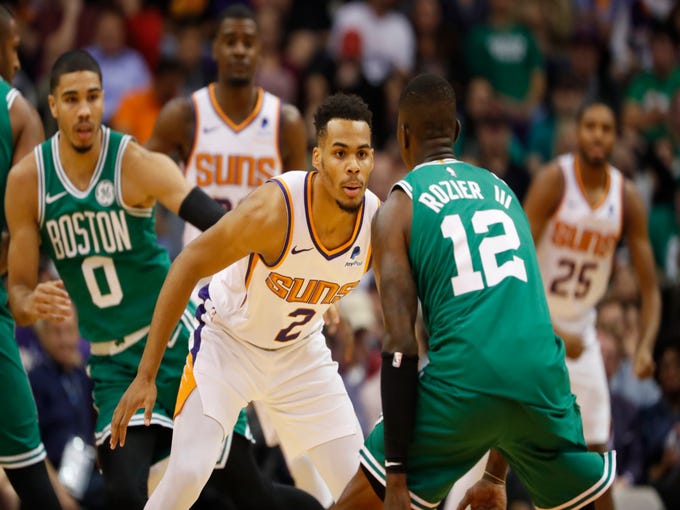 Suns' Elie Okobo (2) defends Celtics' Terry Rozier III (12) during the first half at Talking Stick Resort Arena in Phoenix, Ariz. on November 8, 2018.