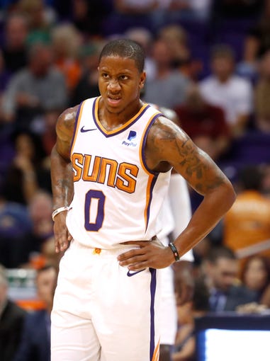 Suns' Isaiah Canaan (0) waits for a timeout to end against the Celtics during the first half at Talking Stick Resort Arena in Phoenix, Ariz. on November 8, 2018.