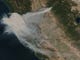 In this image provided by NASA's Earth Observing System Data and Information System (EOSDIS), smoke from the Camp Fire can seen spreading across northern California on Thursday, Nov. 8, 2018.