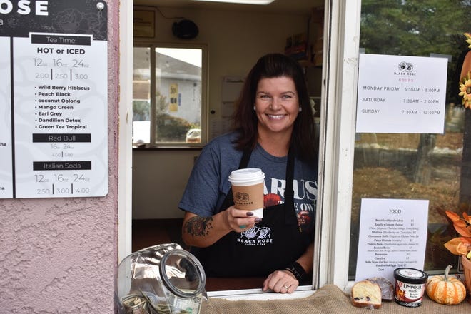 Torrie Rosales serves a customer at her Black Rose Coffee & Tea, a kiosk on Old Oregon.