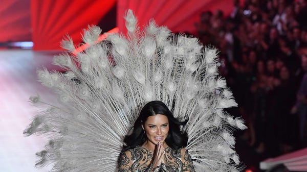 Brazilian model Adriana Lima walks the runway at...