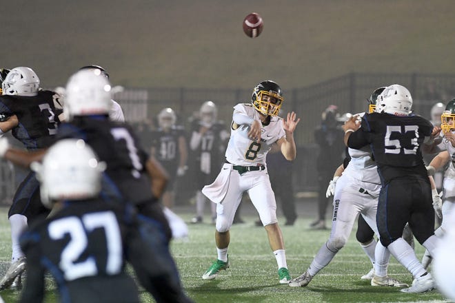 Christ School quarterback Navy Shuler throws a pass during the NCISAA Division I State Championship game at Charlotte Christian School on Nov. 9, 2018. The Greenies fell to the Knights 43-14. 