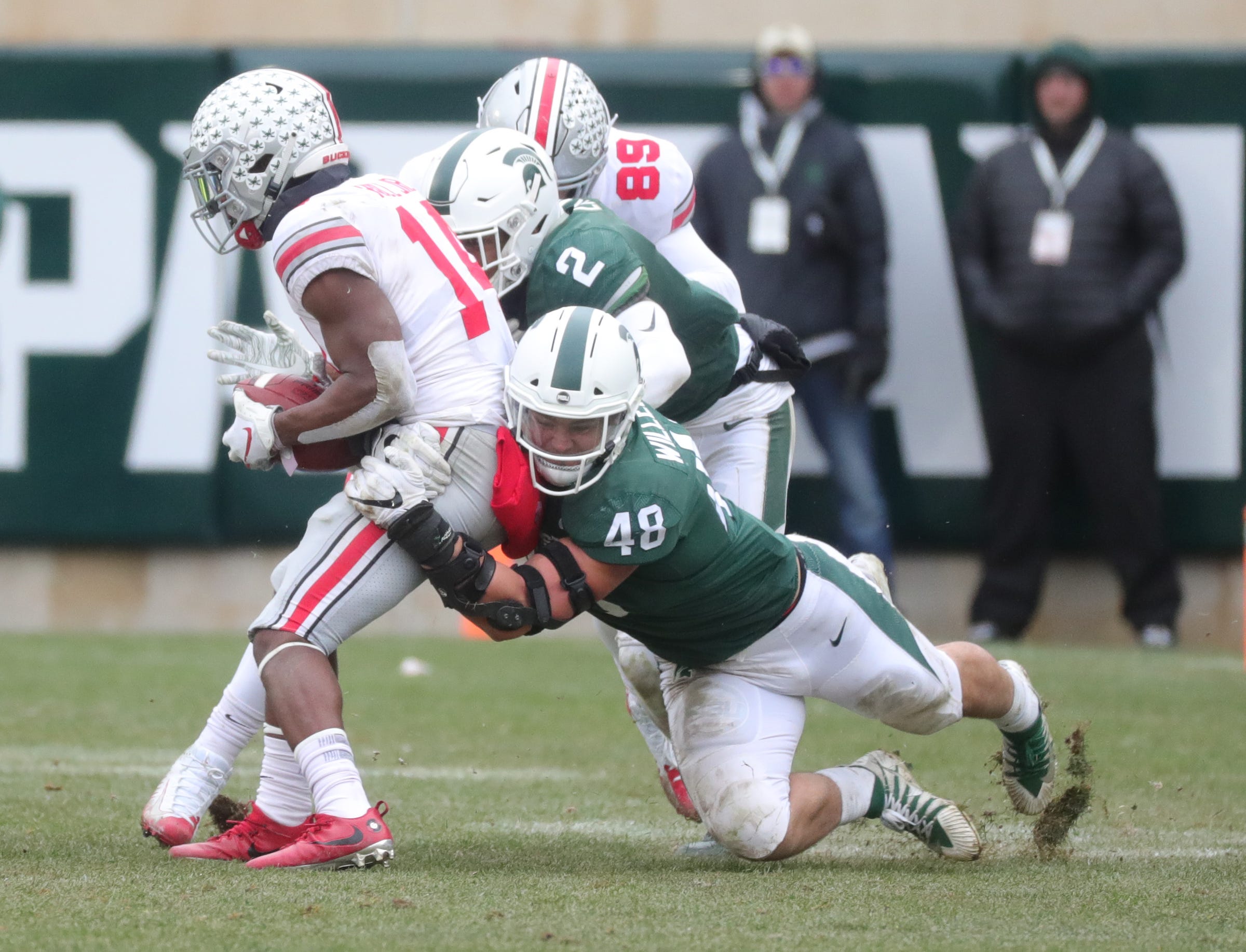 Michigan State DE Kenny Willekes (48) tackles Ohio State's K.J. Hill Jr. in a game this season.