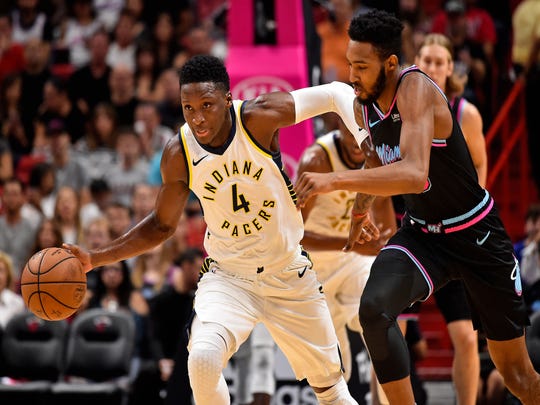 Nov 9, 2018; Miami, FL, USA; Indiana Pacers guard Victor Oladipo (4) dribbles the ball against Miami Heat forward Derrick Jones Jr. (5) during the first half at American Airlines Arena. Mandatory Credit: Jasen Vinlove-USA TODAY Sports
