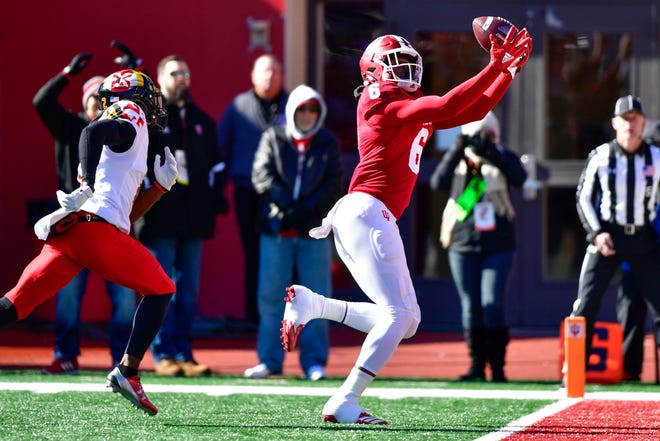 Indiana Hoosiers wide receiver Donavan Hale (6) catches a pass for a touchdown under coverage from Maryland Terrapins defensive back RaVon Davis (2) during the fist half of the the game at Memorial Stadium.