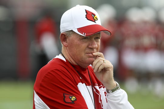 Bobby Petrino watches his team during practice.August 5, 2014