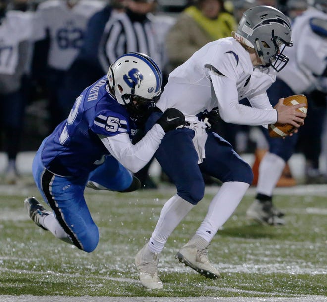 St. Mary’s Springs Jacob Schrauth sacks Lake County Lutheran’s Ethan Wilkins during a playoff game. St Mary's Springs won the Division 5 state championship.