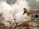 A firefighter pumps water on the smoldering remains of a residence on Friday, Nov. 9, 2018. The Camp Fire devastated Paradise, California on Thursday, Nov. 8, 2018