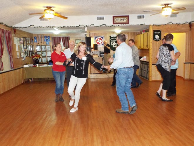 Square dance lessons are underway with Melinda Conklin and Jerrie Smithwick (at left) starting a right and left grand with Wes Thiers while other await their arrival.