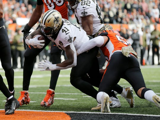 New Orleans Saints running back Alvin Kamara (41) pushes in the the end zone for a touchdown in the second quarter of the NFL Week 10 game between the Cincinnati Bengals and the New Orleans Saints at Paul Brown Stadium in downtown Cincinnati on Sunday, Nov. 11, 2018. The Saints led 35-7 at halftime. 