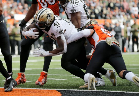 New Orleans Saints running back Alvin Kamara (41) pushes in the the end zone for a touchdown in the second quarter of the NFL Week 10 game between the Cincinnati Bengals and the New Orleans Saints at Paul Brown Stadium in downtown Cincinnati on Sunday, Nov. 11, 2018. The Saints led 35-7 at halftime.