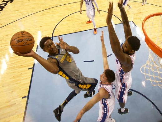 Memphis Grizzlies guard MarShon Brooks lays the ball up against Philadelphia 76ers guard T.J. McConnell, center, and Amir Johnson during their game at the FedExForum on Saturday, November 10, 2018.